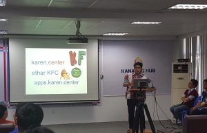 Young Karen IT technician show off their first products and website