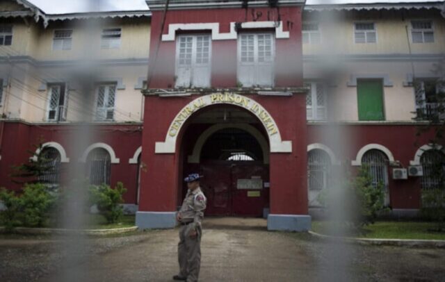 An officer stands guard at the entrance of Yangon’s Insein Prison on June 27, 2016. (AFP)
